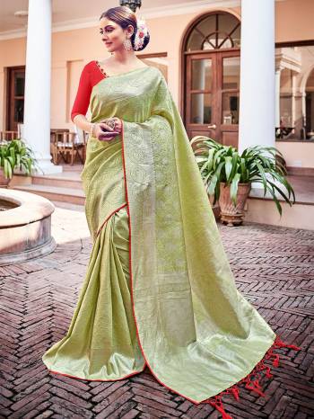 Garb This Fine Colored Saree Paired With Contreased Blouse.This Heavy Designer Wevon Saree Is Banarasi Silk Based Which Gives A Rich Look To Your Personality. Buy This Pretty Saree Now.