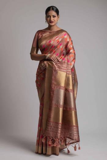 Garb This Partywear Saree Are Fine Saree Paired With Blouse.This Saree And Blouse Are Tussar Silk With Heavy Wevon Designer Work Based Fabric. Buy This Pretty Saree Now.