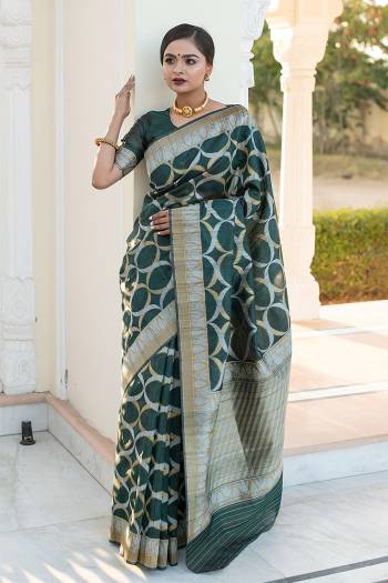 Garb This Partywear Saree Are Fine Saree Paired With Blouse.This Saree And Blouse Are Tussar Silk With Heavy Wevon Designer Work Based Fabric. Buy This Pretty Saree Now.