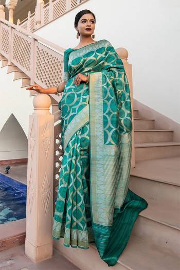 Garb This Partywear Saree Are Fine Saree Paired With Blouse.This Saree And Blouse Are Tussar Silk With Heavy Wevon Designer Work Based Fabric. Buy This Pretty Saree Now.