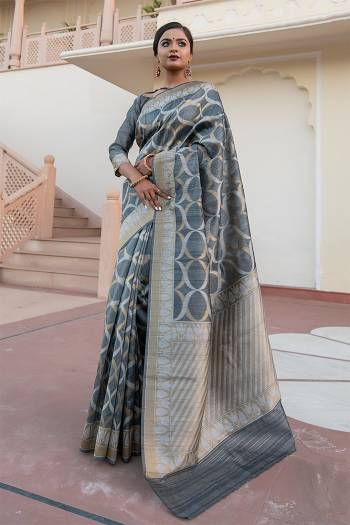 Garb This Partywear Saree Are Fine Saree Paired With Blouse.This Saree And Blouse Are Tussar Silk With Heavy Wevon Designer Work Based Fabric. Buy This Pretty Saree Now.