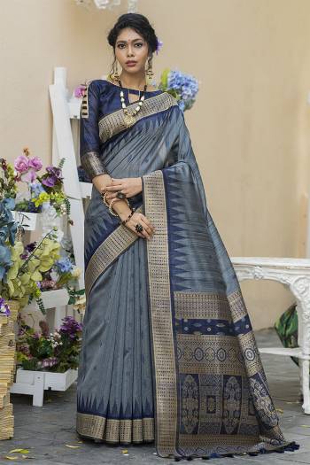 Garb This Partywear Saree Are Fine Saree Paired With Blouse.This Saree And Blouse Are Tussar Silk With Heavy Wevon Designer Work Based Fabric. Buy This Pretty Saree Now.