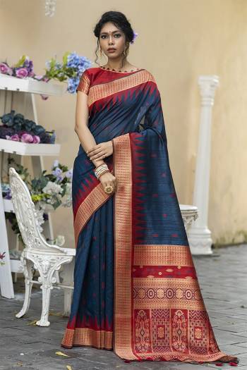 Garb This Partywear Saree Are Fine Saree Paired With Blouse.This Saree And Blouse Are Tussar Silk With Heavy Wevon Designer Work Based Fabric. Buy This Pretty Saree Now.