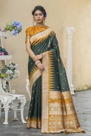 Garb This Partywear Saree Are Fine Saree Paired With Blouse.This Saree And Blouse Are Tussar Silk With Heavy Wevon Designer Work Based Fabric. Buy This Pretty Saree Now.