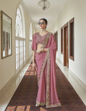 Look Attrectiv This Partywear Saree Are Fine Saree Paired With Blouse.This Saree Are Georgette And Blouse Are Georgette Fabric With Heavy Designer Work Based. Buy This Pretty Saree Now.