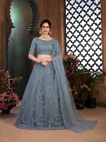 Look Attrective Partywear Heavy Designer Lehenga Choli And Dupatta In Fine Color. Lahenga Choli Fabricated On Net Beautified And  Net Dupatta With Heavy Attractive Thread Embroidery Work. 