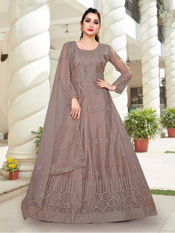 Attrective This Designer Long Length Amarkali In Lovely Color.?Its Pretty Designer Embroidery And Stone Work Top Is Butterfly Net Based Paired With Batterfly Net Fabricated Dupatta Which Gives An Attractive To The Dress.