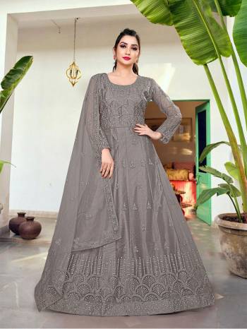 Attrective This Designer Long Length Amarkali In Lovely Color.?Its Pretty Designer Embroidery And Stone Work Top Is Butterfly Net Based Paired With Batterfly Net Fabricated Dupatta Which Gives An Attractive To The Dress.