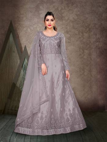 Garb This Designer Long Length Anarkali In Lovely Color.?Its Pretty Designer Embroidery And Stone Work Top Is Butterfly Net Based Paired With Batterfly Net Fabricated Dupatta Which Gives An Attractive To The Dress.