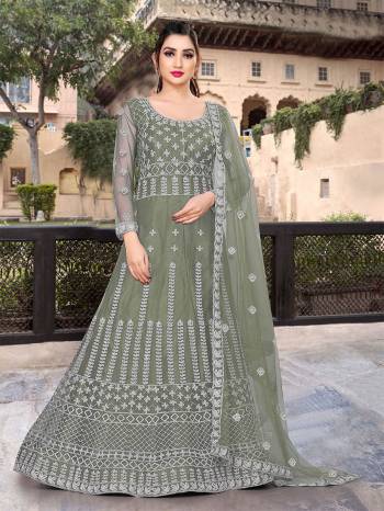 Garb This Partywear Designer Long Length Amarkali In Lovely Color.?Its Pretty Designer Embroidery Work Top Is Butterfly Net Based Paired With Batterfly Net Fabricated Dupatta. Which Gives An Attractive To The Dress.