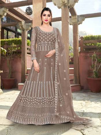 Garb This Partywear Designer Long Length Amarkali In Lovely Color.?Its Pretty Designer Embroidery Work Top Is Butterfly Net Based Paired With Batterfly Net Fabricated Dupatta. Which Gives An Attractive To The Dress.