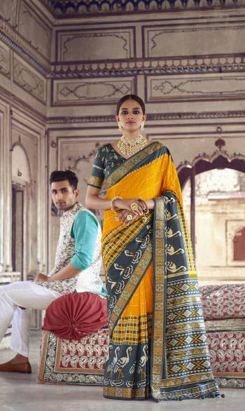 Garb This Partywear Saree Are Fine Saree Paired With Contrasted Blouse.This Saree And Blouse Are Patola Silk With Heavy Wevon Designer Work Based Fabric. Buy This Pretty Saree Now.