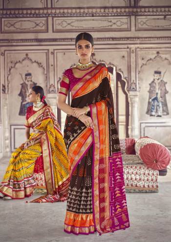 Garb This Partywear Saree Are Fine Saree Paired With Contrasted Blouse.This Saree And Blouse Are Patola Silk With Heavy Wevon Designer Work Based Fabric. Buy This Pretty Saree Now.