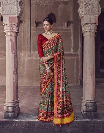 Garb This Partywear Saree Are Fine Saree Paired With Contrasted Blouse.This Saree And Blouse Are Patola Silk With Heavy Wevon Designer Work Based Fabric. Buy This Pretty Saree Now.