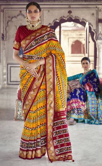 Garb This Partywear Saree Are Fine Saree Paired With Contrasted Blouse.This Saree And Blouse Are Patola Silk With Heavy Wevon Designer Work Based Fabric. Buy This Pretty Saree Now.