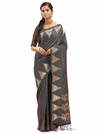 Garb This Saree Are Fine Saree Paired With Blouse.This Saree And Blouse Are Cotton Silk With Wevon Designer Work Based Fabric. Buy This Pretty Saree Now.