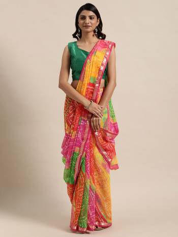 Garb This Saree Are Fine Saree Paired With Blouse.This Saree Are Georgette And Blouse Are Art Silk Fabric With Designer Bandhani Printed. Buy This Pretty Saree Now.