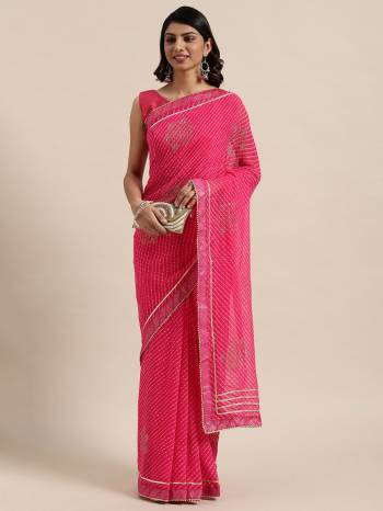 Garb This Saree Are Fine Saree Paired With Blouse.This Saree Are Georgette And Blouse Are Art Silk Fabric With Designer Bandhani Printed With Gota Pati And Swaroski Work. Buy This Pretty Saree Now.