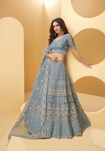 Attrective Bridal Partywear Heavy Designer Lehenga Choli And Dupatta In Fine Color Fabricated On Net Beautified With Heavy Attractive Dori, Thread,Sequance Embroidery And Hand Zarkan Work. 