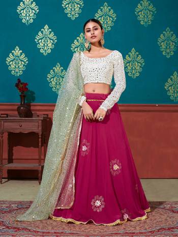 Look Attrective Partywear Heavy Designer Lehenga Choli And Dupatta In Fine Color. Lahenga Choli Are Fabricated On Georgette Beautified And Dupatta Are Net With Attrective Pigment Foil Printed And Mirror Work. 