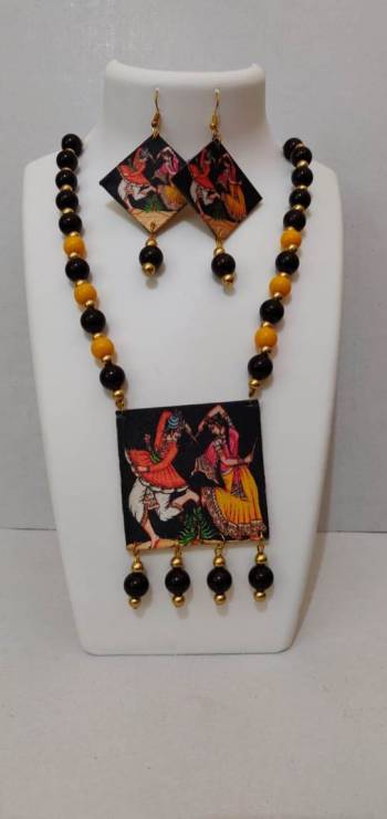 Give An Enhanced Look To Your Navratri Special This Beautiful Necklace Set With Your Ethnic Attire. This Pretty Set Is In Multy Color Beautified With Wooden Digital With Moti Work. Buy Now.