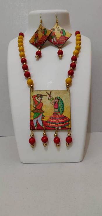 Give An Enhanced Look To Your Navratri Special This Beautiful Necklace Set With Your Ethnic Attire. This Pretty Set Is In Multy Color Beautified With Wooden Digital With Moti Work. Buy Now.