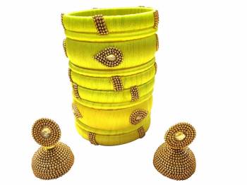 Give An Enhanced Look To Your Personality By Pairing Up This Beautiful Bengle With Earring Set With Your Ethnic Attire. This Pretty Set Is In Fine Color Beautified With Stone Work. Buy Now.