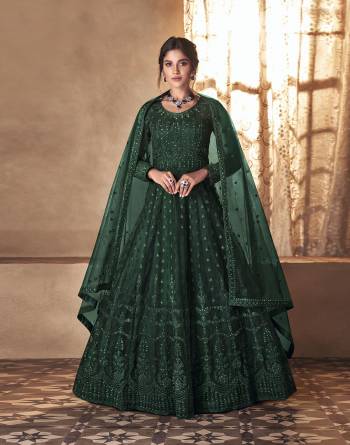 Looking This Designer Long Length Suit In Lovely Color.Its Pretty Heavy Designer Embroidery With Stone Work Top Is Butterfly Net Based Paired With Satin Bottom And Butterfly Net Fabricated Dupatta Which Gives An Attractive To The Suit.