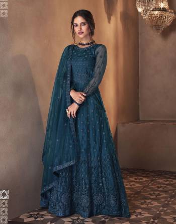 Looking This Designer Long Length Suit In Lovely Color.Its Pretty Heavy Designer Embroidery With Stone Work Top Is Butterfly Net Based Paired With Satin Bottom And Butterfly Net Fabricated Dupatta Which Gives An Attractive To The Suit.