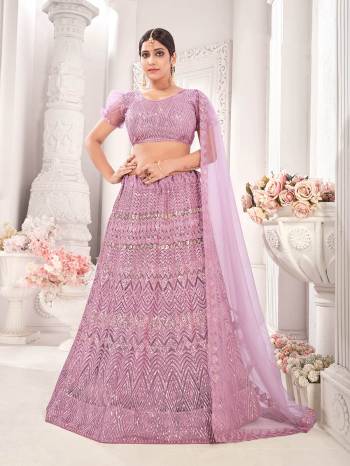 Garb This Wedding Partywear Heavy Designer Lehenga Choli And Dupatta In Fine Color Fabricated On Net Beautified Fabric With Designer Printed With Pattern Embroidery Work. 