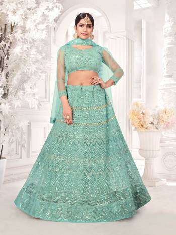 Garb This Wedding Partywear Heavy Designer Lehenga Choli And Dupatta In Fine Color Fabricated On Net Beautified Fabric With Designer Printed With Pattern Embroidery Work. 