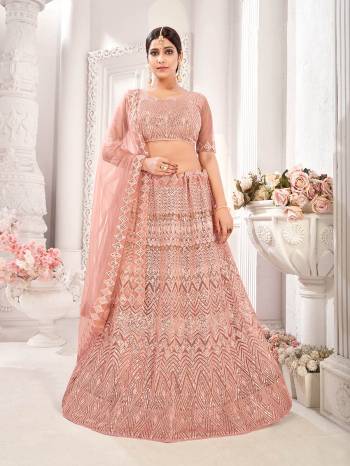 Garb This Wedding Partywear Heavy Designer Lehenga Choli And Dupatta In Fine Color Fabricated On Net Beautified Fabric With Designer Printed With Pattern Embroidery Work. 