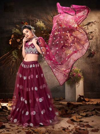 Garb This Partywear Heavy Designer Lehenga Choli And Dupatta In Fancy Color Fabricated On Soft Net Beautified With Heavy Attractive Mirror,Gota And Jari Embroidery Work. 