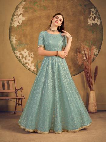 Flaunt Your Rich And Elegant Taste Wearing This Designer Long Gown In Light Color. This Pretty Gown Is Fabricated On Net Beautified With Metalic Foil Work. Its Fabric Is Soft Towards Skin And Easy To Carry All Day Long. 