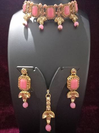 Give An Enhanced Look To Your Personality By Pairing Up This Beautiful Necklace Set With Your Ethnic Attire. This Pretty Set Is In Golden Color Beautified With Diamond And Crystal Work. Buy Now.