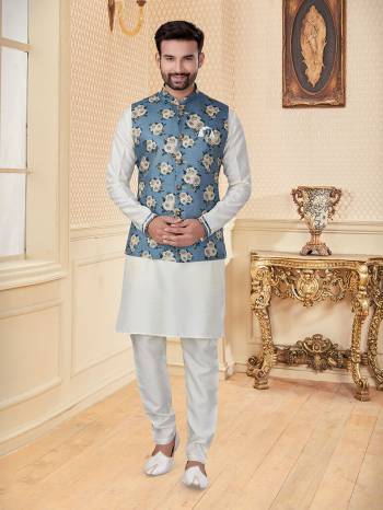 Take your ethnic style quotient to the next level by wearing this fashionable Jacket With Kurta Payajama. Tailored from finest Art Silk fabric With Designer Work and fashioned with a banded collar for a dash of style.