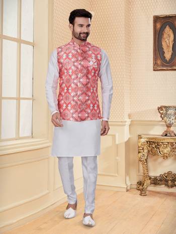 Take your ethnic style quotient to the next level by wearing this fashionable Jacket With Kurta Payajama. Tailored from finest Art Silk fabric With Designer Work and fashioned with a banded collar for a dash of style.