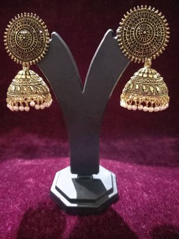 Give An Enhanced Look To Your Personality By Pairing Up This Beautiful Earring With Your Ethnic Attire. This Pretty Set Is In Golden Color Beautified With Oxodised Plating Work. Buy Now.