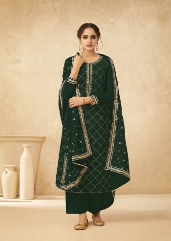 Attrective Look This Designer Long Length Suit In Lovely Color.Its Pretty Heavy Designer Embroidery Work Top Is Georgette Based Paired With Dull Santoon Bottom And Georgette Fabricated Dupatta Which Gives An Attractive To The Suit.