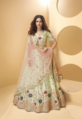 Garb This Partywear Heavy Designer Lehenga Choli And Dupatta In Fancy Color Fabricated On Silk Beautified With Butterfly Net Dupatta And Heavy Attractive Cording,Sequance,Thread Embroidery With Zarkan Hand Work. 