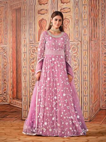 Garb This Designer Long Length Suit In Lovely Light Color.Its Pretty Heavy Designer Embroidery Work Top Is Net Based Paired With Santoon Bottom And Net Fabricated Dupatta Which Gives An Attractive To The Suit.