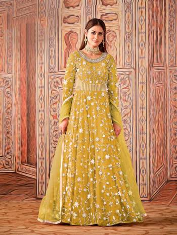 Garb This Designer Long Length Suit In Lovely Light Color.Its Pretty Heavy Designer Embroidery Work Top Is Net Based Paired With Santoon Bottom And Net Fabricated Dupatta Which Gives An Attractive To The Suit.