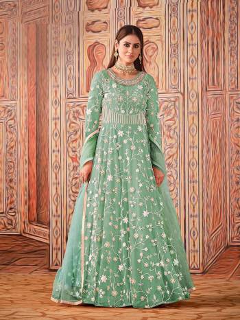 Garb This Designer Long Length Suit In Lovely Light Color.Its Pretty Heavy Designer Embroidery Work Top Is Net Based Paired With Santoon Bottom And Net Fabricated Dupatta Which Gives An Attractive To The Suit.