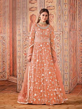 Garb This Designer Long Length Suit In Lovely Light Color.Its Pretty Heavy Designer Embroidery Work Top Is Net Based Paired With Santoon Bottom And Net Fabricated Dupatta Which Gives An Attractive To The Suit.