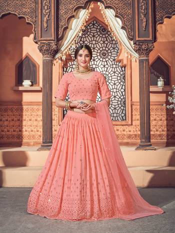 Garb This Wedding Partywear Heavy Designer Lehenga Choli And Dupatta In Fine Color Fabricated On Georgette Beautified With Heavy Attractive Thread,Sequance Embroidery Work. 