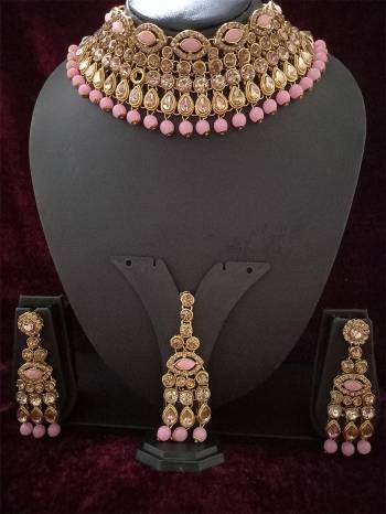 An Enhanced Look To Your Personality By Pairing Up This Beautiful Necklace Set With Your Ethnic Attire. This Pretty Set Is In Golden Color Beautified With Amond,Kundan And Pearl MotiWork. Buy Now.