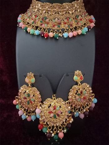 An Enhanced Look To Your Personality By Pairing Up This Beautiful Necklace Set With Your Ethnic Attire. This Pretty Set Is In Golden Color Beautified With Amond,Kundan And Pearl MotiWork. Buy Now.