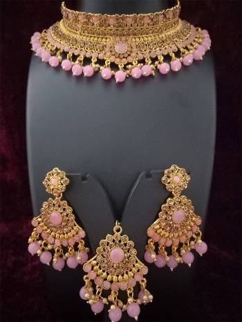 An Enhanced Look To Your Personality By Pairing Up This Beautiful Necklace Set With Your Ethnic Attire. This Pretty Set Is In Golden Color Beautified With Amond,Kundan And Pearl MotiWork. Buy Now.