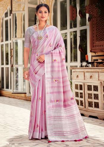 Looking This Traditional Saree Are Fine Saree Paired With Blouse.This Saree And Blouse Are Linen Based Fabric With Heavy Wevon Designer Work. Buy This Pretty Saree Now.