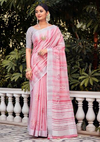 Looking This Traditional Saree Are Fine Saree Paired With Blouse.This Saree And Blouse Are Linen Based Fabric With Heavy Wevon Designer Work. Buy This Pretty Saree Now.